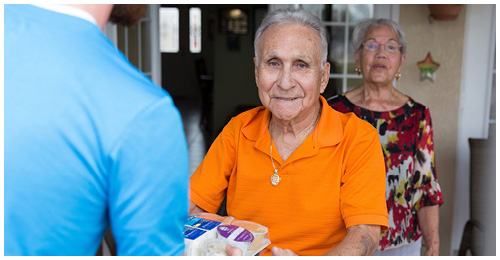 old person receiving meal